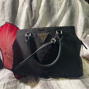 Guess satchel with handle and adjustable strap.like new with silver hardware.